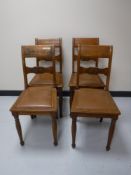 A set of four early 20th century leather seated chairs