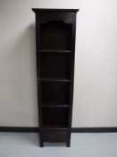 A set of hardwood open shelves fitted with a drawer