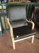 A contemporary Danish beech framed brown leather armchair