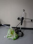 A MacAllister bush cutter, spare reel, soil cutter and cable,