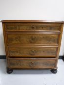 A late 19th century mahogany four drawer chest on bun feet