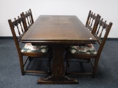 An Ercol refectory extending table and four chairs