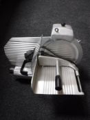 A stainless steel meat slicer