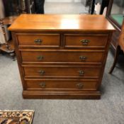 A contemporary five drawer chest,