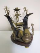 An Anglo Indian brass and rams horn desk stand on a heart shaped mahogany base