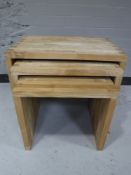 A nest of three contemporary tables