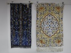 Two fringed Eastern wall hangings