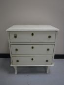 A 20th century painted pine three drawer chest