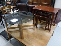 A mid 20th century teak smoked glass topped table and a nest of tables