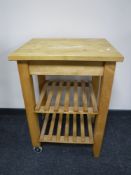 A pine butcher's block trolley