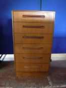 A teak G Plan tall boy chest