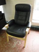 A beech framed black leather adjustable armchair