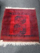 An Afghan Bokhara design rug,