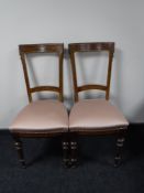 A pair of inlaid dining chairs