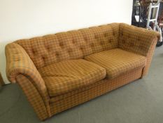 A Chesterfield style settee in check button fabric