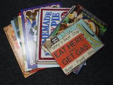 Fourteen tin advertising signs - Wurlizter, Betty Boo,