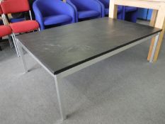 A late 20th century slate topped coffee table on metal legs