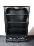A set of black contemporary open bookshelves fitted three drawers