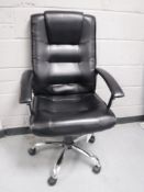 A contemporary leather office armchair