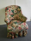 An early 20th century ladies chair with loose cover
