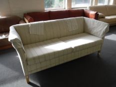 A mid 20th century two seater settee in black striped fabric