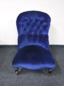 A Victorian lady's chair in blue button fabric