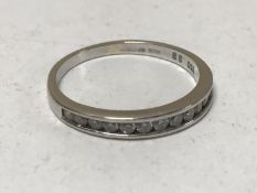 An 18ct gold diamond half eternity ring