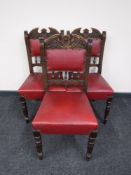A set of three carved oak Edwardian dining chairs