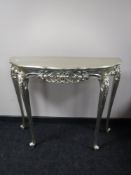 A pair of ornate silvered console tables CONDITION REPORT: 104cm wide by 38cm deep