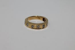 18ct half eternity ring with eight stones 5.