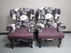 A pair of wing back armchairs in a floral fabric