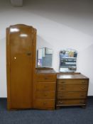 An oak sentry door wardrobe, fitted with a four drawer dressing chest,