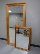 A large pine framed mirror and one other