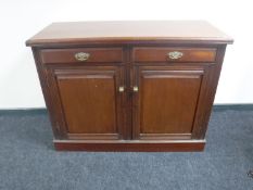An Edwardian mahogany double door cupboard