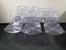 A set of six Italian Calligaris L'eau designer clear dining chairs on metal legs with a black glass