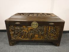 An early 20th century carved camphor wood chest,