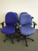 Four blue office swivel armchairs