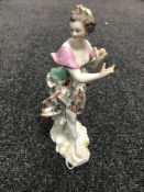 A Derby porcelain figure of a female musician