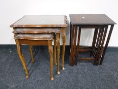 A nest of three walnut tables and a nest of three oak tables