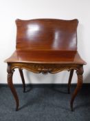 A late 19th century foldover tea table
