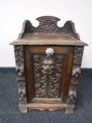 A Victorian heavily carved oak coal receiver with liner