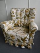 An Art Deco armchair in floral fabric