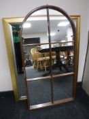 A teak sectional domed topped mirror,
