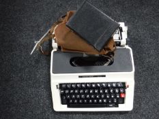 A case Silver Reed 500 typewriter and an Agfa camera