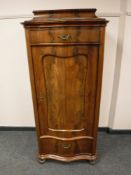 A 19th century mahogany serpentine fronted cabinet fitted two drawers,