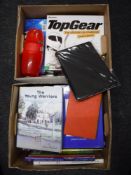 Four boxes of assorted pictures and picture frames, books, board games and jigsaws,