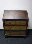 A Victorian inlaid mahogany bureau