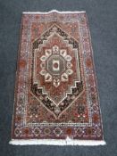 A Persian rug of geometric design,