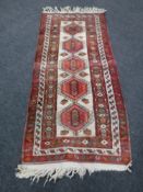 A Persian geometric design rug,