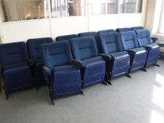 A row of twelve folding cinema armchairs